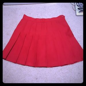 Red pleated miniskirt